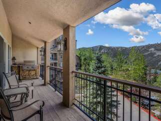 Enjoy breathtaking mountain views from this spacious balcony, perfect for outdoor dining and relaxation.