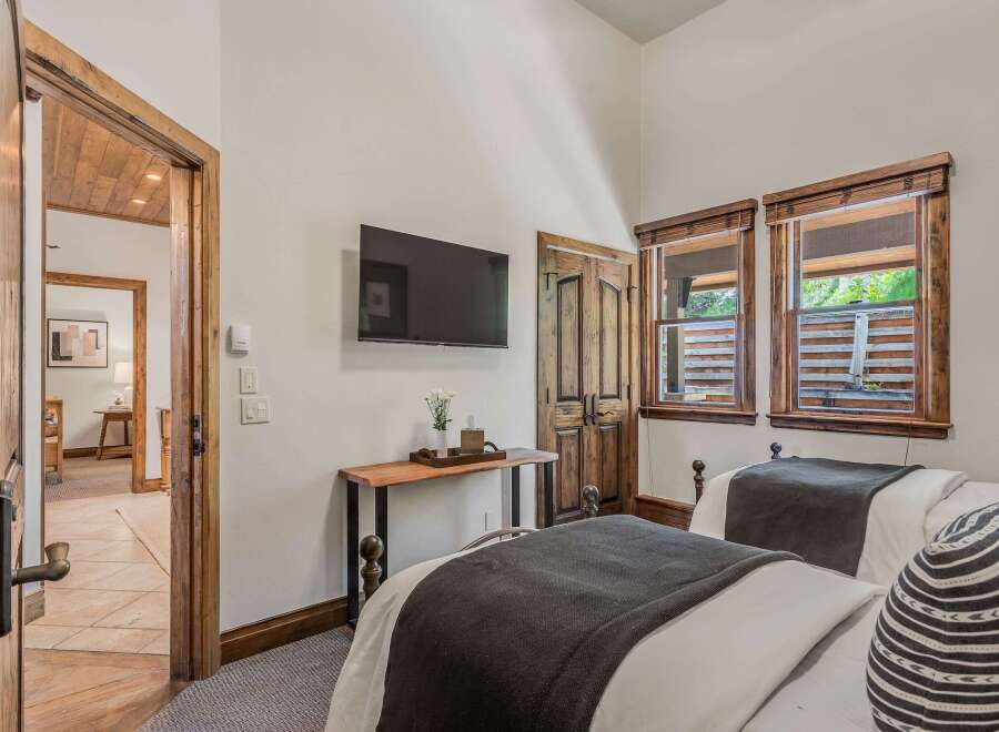 This charming bedroom features two comfortable beds, perfect for accommodating guests or family.