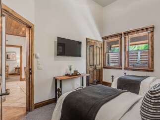 This charming bedroom features two comfortable beds, perfect for accommodating guests or family.