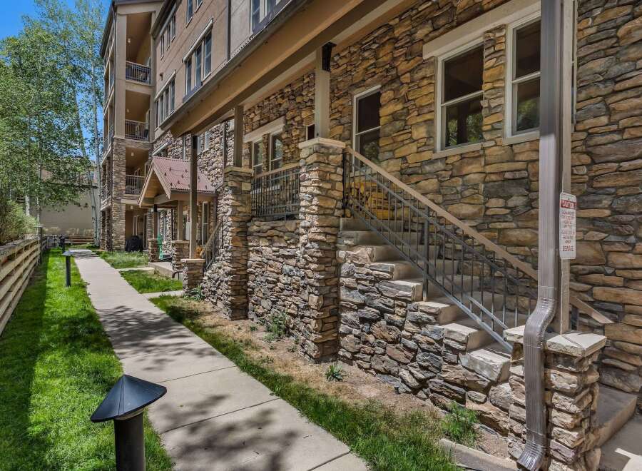 Discover this charming property featuring a beautiful stone facade and a welcoming covered entryway.