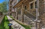 Discover this charming property featuring a beautiful stone facade and a welcoming covered entryway.