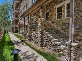 Discover this charming property featuring a beautiful stone facade and a welcoming covered entryway.