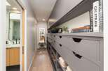 Discover a sophisticated walk-in closet and ensuite bathroom, perfect for modern living.