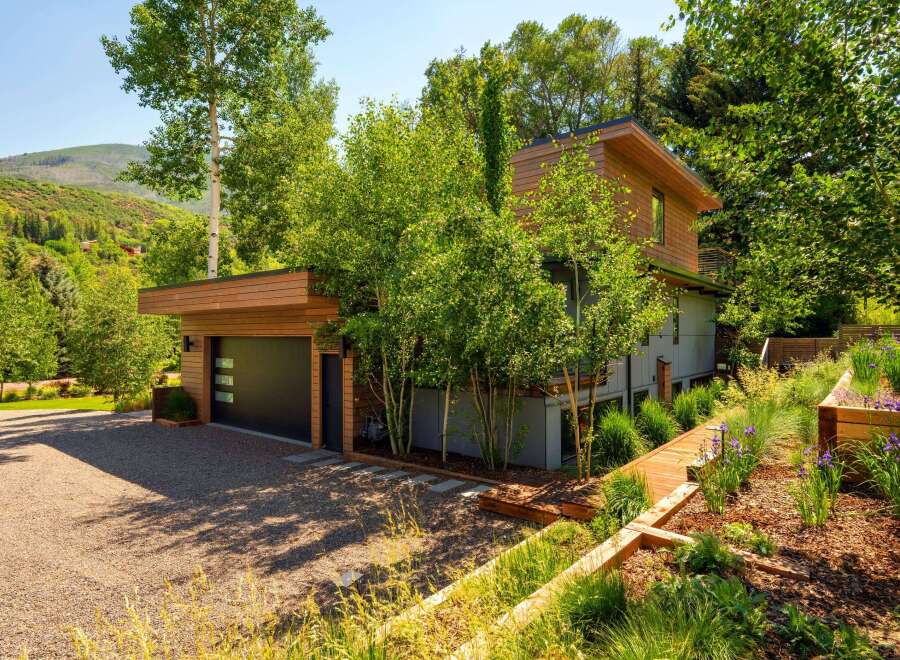 Experience modern mountain living in this stunning architectural home, nestled amidst lush greenery and scenic mountain views.