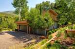 Experience modern mountain living in this stunning architectural home, nestled amidst lush greenery and scenic mountain views.