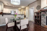 This inviting dining area features a sleek glass-top dining table with plush chairs, perfect for intimate meals.