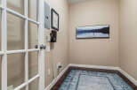 Step into this inviting space featuring elegant French doors that open to a well-appointed room.