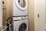 Discover the convenience of this stacked Samsung washer and dryer, perfect for optimizing space in your laundry area.