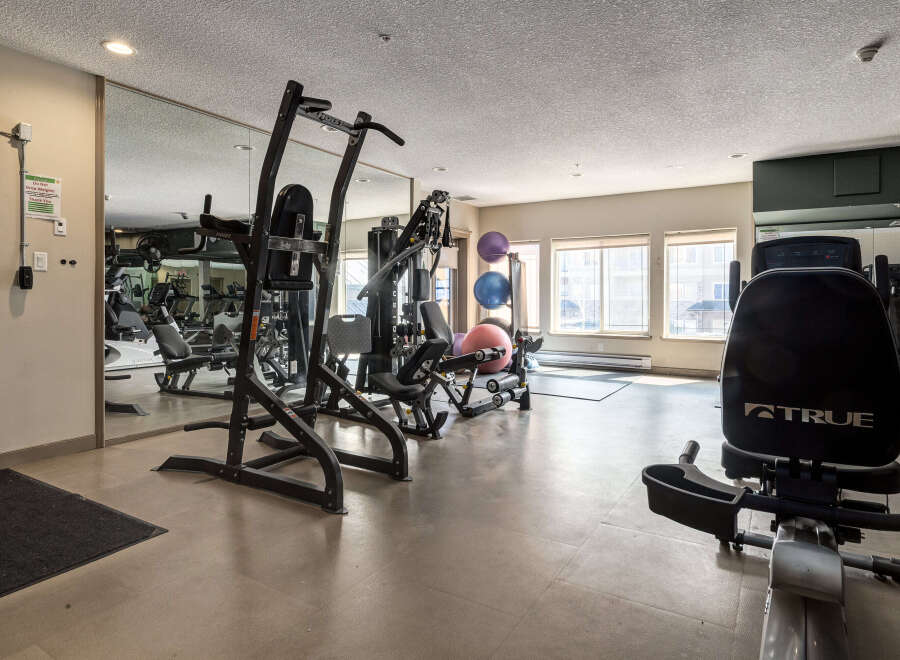 Stay active and healthy in this well-equipped fitness center, featuring a variety of strength training machines and cardio equipment.