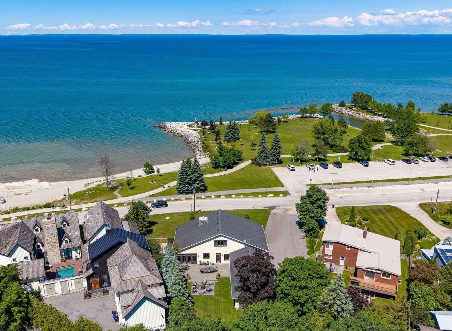Experience coastal living at its finest with this stunning property offering direct access to a beautiful beach and panoramic views of the azure water.