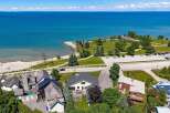 Experience coastal living at its finest with this stunning property offering direct access to a beautiful beach and panoramic views of the azure water.