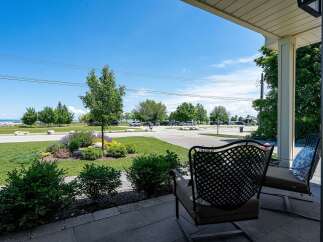 Enjoy serene lake views from this charming property, perfect for relaxing evenings on the porch.