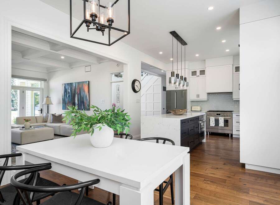 Experience modern living in this stunning open-concept home, featuring a gourmet kitchen with a large island and sleek cabinetry.