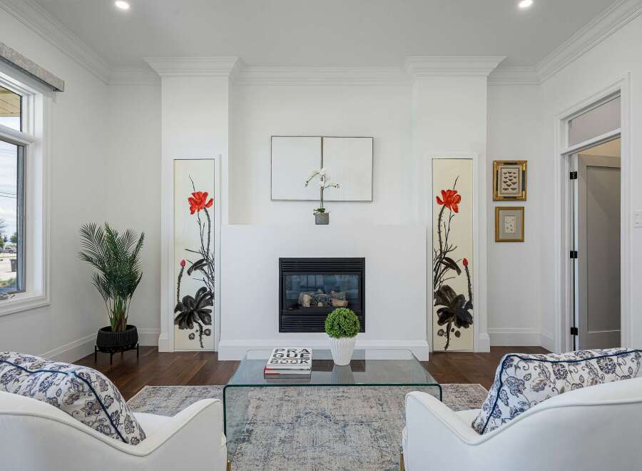 Experience elegant living in this beautifully appointed living room, featuring a modern fireplace as the focal point.