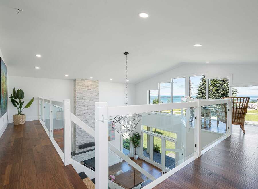 Experience breathtaking ocean views from this stunning modern home, featuring an open-concept living space with vaulted ceilings and abundant natural light.