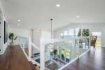 Experience breathtaking ocean views from this stunning modern home, featuring an open-concept living space with vaulted ceilings and abundant natural light.