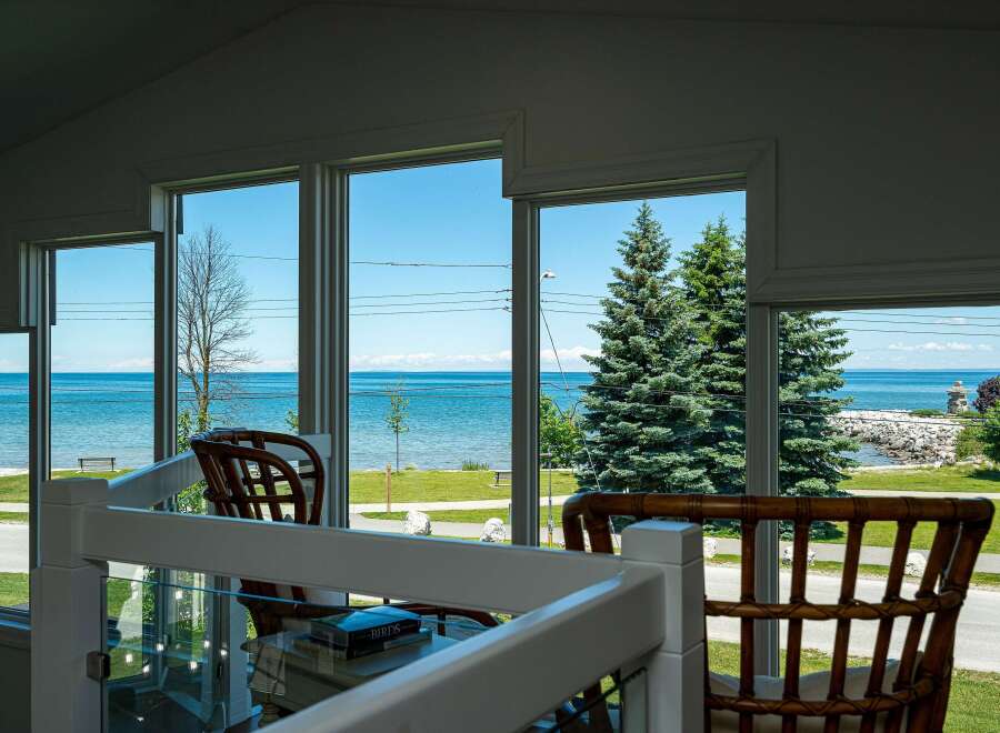 Enjoy breathtaking lake views from this stunning property, perfect for those seeking a serene coastal lifestyle.
