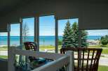 Enjoy breathtaking lake views from this stunning property, perfect for those seeking a serene coastal lifestyle.