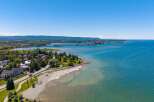 Experience waterfront living at its finest with this stunning property offering panoramic views of the crystal-clear blue waters.