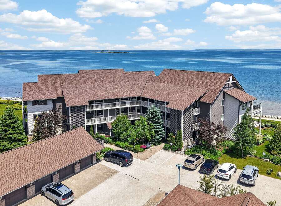 Experience breathtaking waterfront living in this stunning property offering panoramic views of the serene blue waters.