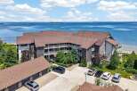 Experience breathtaking waterfront living in this stunning property offering panoramic views of the serene blue waters.