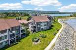 Experience luxury living with stunning lake views and mountain vistas from this modern condominium complex.