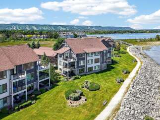 Experience luxury living with stunning lake views and mountain vistas from this modern condominium complex.