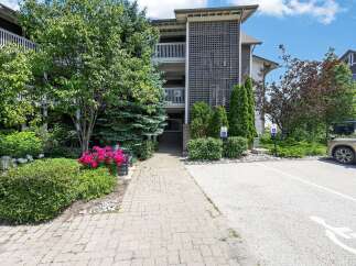 Discover comfortable living in this well-maintained building, featuring a welcoming paved walkway leading to the entrance.