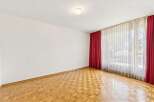This spacious room features beautiful parquet flooring that adds warmth and character.