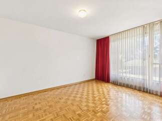 This spacious room features beautiful parquet flooring that adds warmth and character.