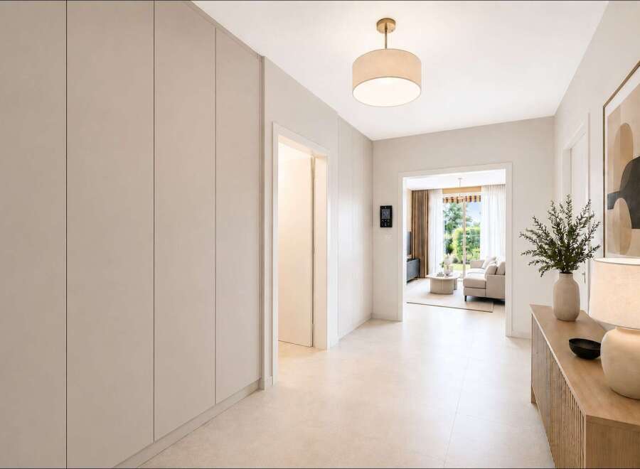 Step into this inviting hallway, featuring sleek, built-in storage solutions that maximize space and maintain a clean aesthetic.
