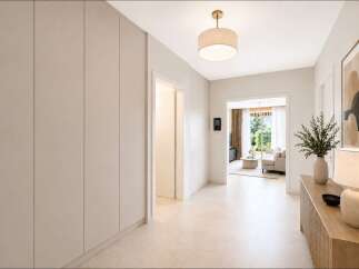 Step into this inviting hallway, featuring sleek, built-in storage solutions that maximize space and maintain a clean aesthetic.