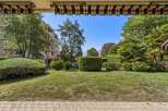 Enjoy the lush greenery and serene ambiance from this property's vantage point, overlooking a beautifully manicured garden.