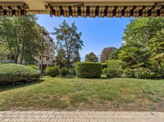 Enjoy the lush greenery and serene ambiance from this property's vantage point, overlooking a beautifully manicured garden.