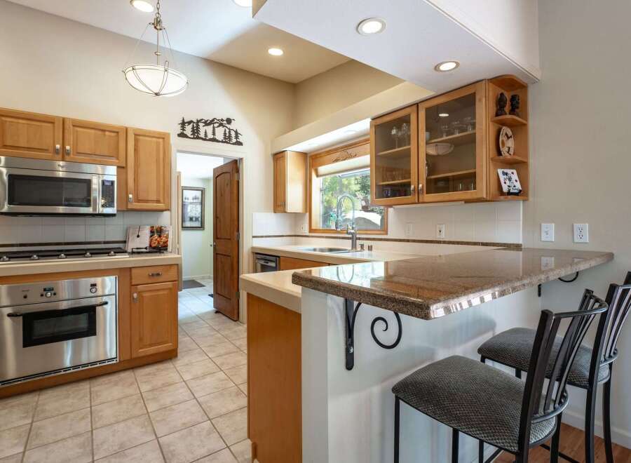 This charming kitchen boasts ample natural light and a functional layout, perfect for any home chef.