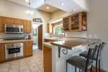 This charming kitchen boasts ample natural light and a functional layout, perfect for any home chef.