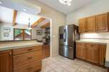 Discover a charming kitchen featuring a stainless steel Samsung refrigerator and ample natural light.