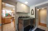 Discover the convenience of this well-appointed laundry room, featuring modern Samsung washer and dryer units.