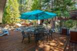 Enjoy outdoor living on this spacious wooden deck, perfect for entertaining or relaxing.
