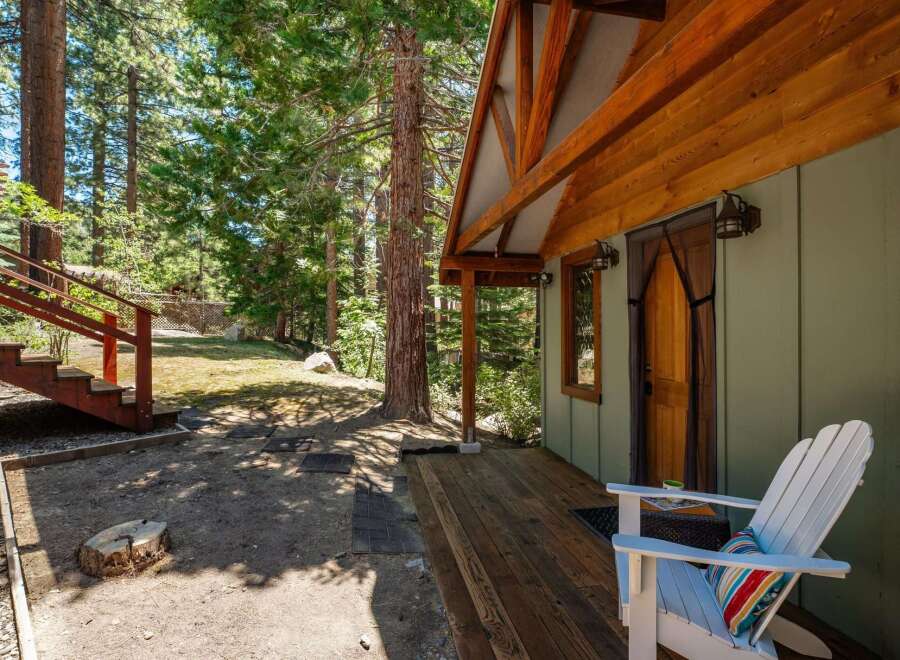 Escape to this charming cabin nestled amongst tall pine trees, offering a serene mountain retreat.