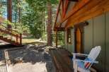 Escape to this charming cabin nestled amongst tall pine trees, offering a serene mountain retreat.
