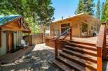 Enjoy outdoor living with this expansive wooden deck, perfect for entertaining or relaxing in the fresh air.