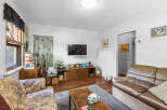 Step into this cozy living room, perfect for relaxation and entertainment.