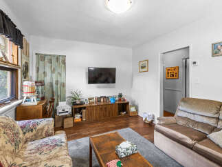 Step into this cozy living room, perfect for relaxation and entertainment.