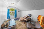Discover a cozy attic room perfect for a home office or creative space.