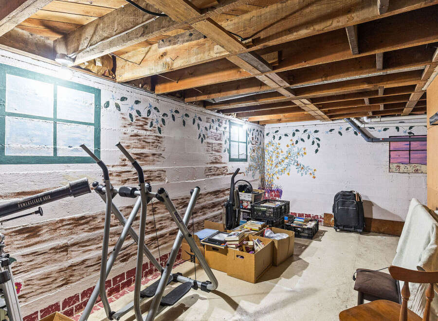 Discover potential in this unfinished basement, offering a versatile space for storage or future customization.