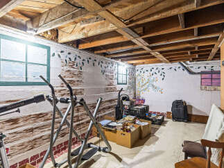 Discover potential in this unfinished basement, offering a versatile space for storage or future customization.