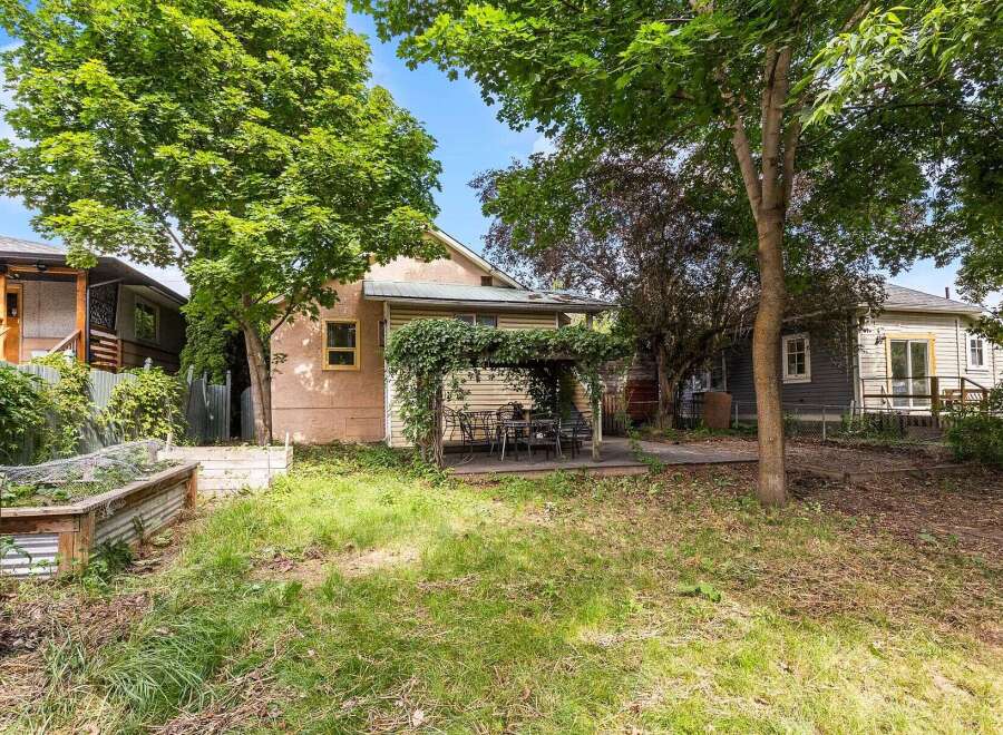 Discover a charming backyard oasis perfect for relaxation and entertaining.