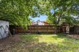 Discover this charming backyard, perfect for outdoor living and entertaining.