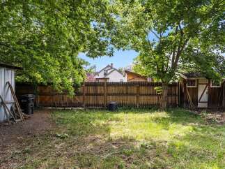 Discover this charming backyard, perfect for outdoor living and entertaining.